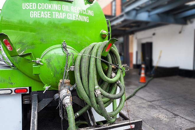 heavy-duty vacuum truck pumping out a grease trap in Lake Montezuma